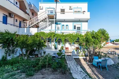 a view of the side of a building with trees at Dimitras Luxus House in Archangelos