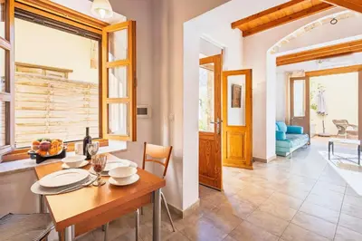 a kitchen and dining room with a table and chairs at Maison Roxanne & Maisonette in medieval city by Rhodes4vacation in Rhodes Town