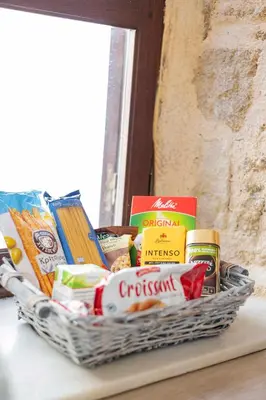 a basket of junk food on a table at Maison Roxanne & Maisonette in medieval city by Rhodes4vacation in Rhodes Town