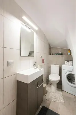 a bathroom with a sink and a washing machine at Maison Roxanne & Maisonette in medieval city by Rhodes4vacation in Rhodes Town