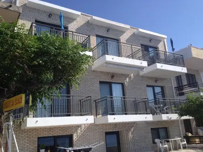 a building with balconies on the side of it at Horizon View Studio in Haraki