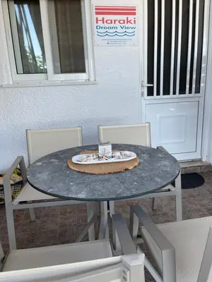 a table with a cake on top of it at Haraki Dream View in Haraki