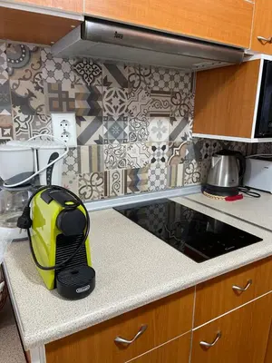 a yellow and black backpack sitting on a kitchen counter at Haraki Dream View in Haraki