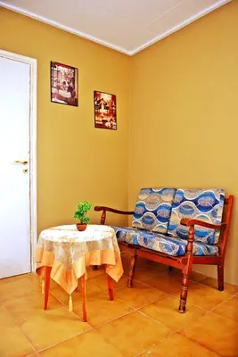 a living room with a couch and a table at Praxitelous 9 Old Town in Rhodes Town