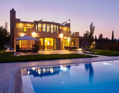 a house with a swimming pool in front of it at Luxury Villa Trapezia in Afantou