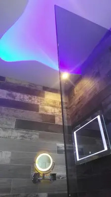 a bathroom with a urinal and a purple ceiling at Bright Star in Faliraki