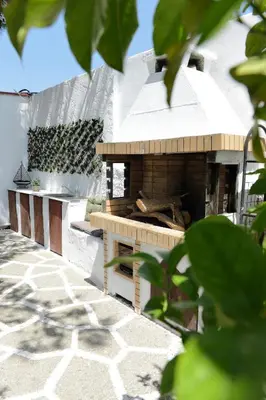 a model of a house with an outdoor oven at Villa Nastazia in Kiotari