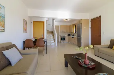 a living room with a couch and a table at Villa Nastazia in Kiotari