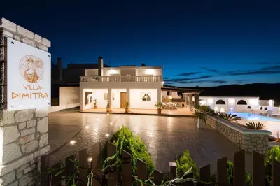 a villa with a swimming pool at night at Villa Dimitra Gennadi in Gennadi