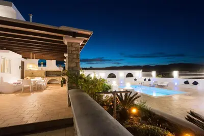 a villa with a swimming pool at night at Villa Dimitra Gennadi in Gennadi
