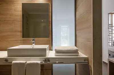 a bathroom with a sink and a mirror at Atlantica Mikri Poli Rhodes in Kolimbia