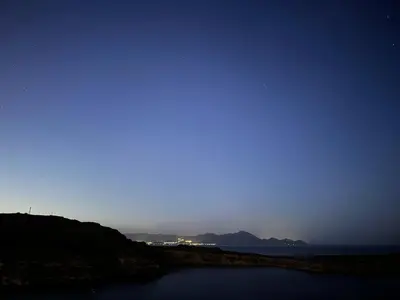 a view of the ocean at night at Villa Vasilia in Líndos