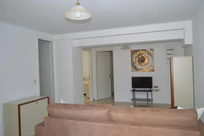 a living room with a couch and a television at Anthi City Center Apartment in Rhodes Town