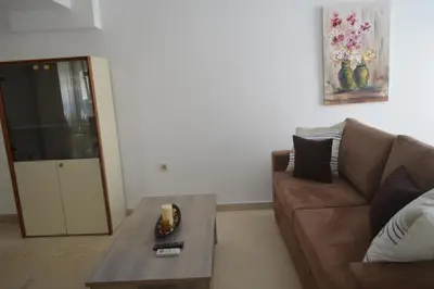a living room with a couch and a coffee table at Anthi City Center Apartment in Rhodes Town