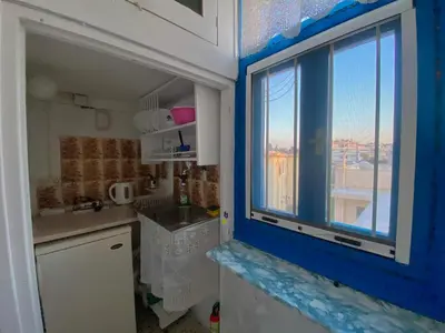 a small kitchen with a window and a sink at Florida Hotel & Apartments - Adults Only in Rhodes Town