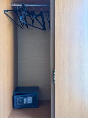 a room with a closet with a door and a tv at Florida Hotel & Apartments - Adults Only in Rhodes Town