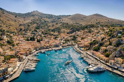 an aerial view of a harbor with boats in the water at Marika's Deluxe Rooms in Symi