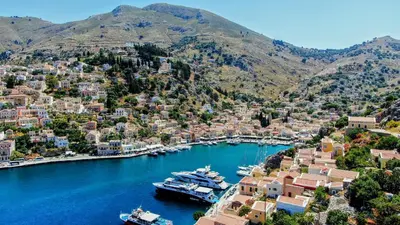 an aerial view of a harbor with boats in the water at Marika's Deluxe Rooms in Symi