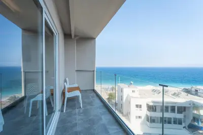 a balcony with a view of the ocean at Arte Hotel in Rhodes Town