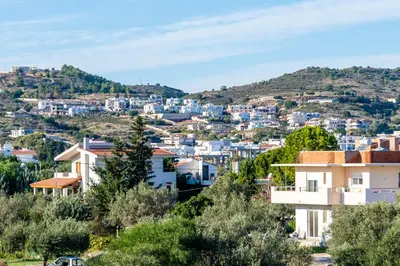 a view of a city with blue buildings at Villa Maroula in Afantou