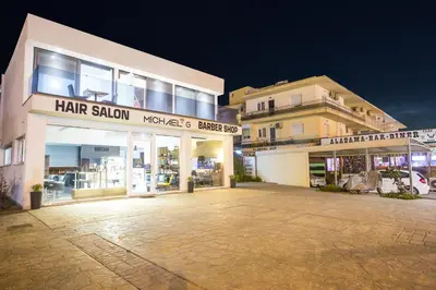 a store front of a building at night at Yianna's Flat in Faliraki
