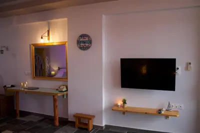 a living room with a flat screen tv on a wall at Seascape Apartment with Private Balcony in Faliraki in Faliraki