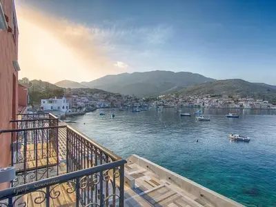 a view of a harbor with boats in the water at Aretanassa Hotel in Halki