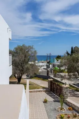 a view of the ocean from the balcony of a house at Stelios studios in Archangelos