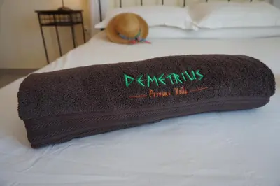 a towel is sitting on top of a bed at Rhodes Demetrius Luxury Private Villa in Kalathos