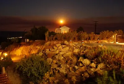 a building with a light on top of a pile of rocks at Rhodes Demetrius Luxury Private Villa in Kalathos