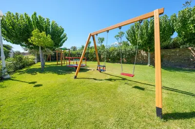 an empty swing set in a yard at Atrium Prestige Thalasso Spa Resort & Villas in Lachania