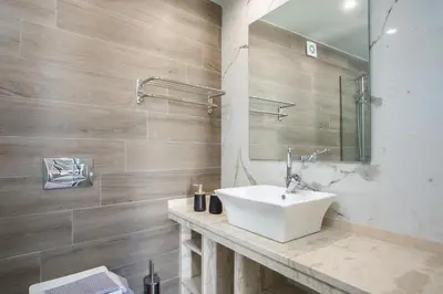 a bathroom with a sink and a mirror at GM Villa Kallithies Village in Kallithea Rhodes