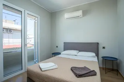 a bedroom with a bed with two towels on it at GM Villa Kallithies Village in Kallithea Rhodes
