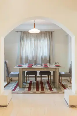 a dining room with a table and chairs at GM Villa Kallithies Village in Kallithea Rhodes