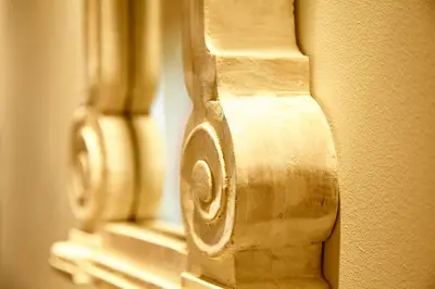 a close up of a wooden door with a wooden handle at Unique Apartment in the Heart of the City in Rhodes Town
