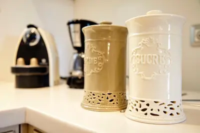 two containers sitting on top of a kitchen counter at Unique Apartment in the Heart of the City in Rhodes Town