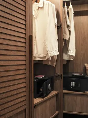 a room with a closet with a microwave at Lindos Princess Beach Hotel in Lardos