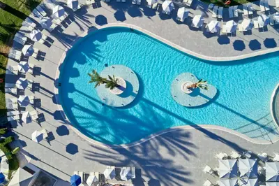 an overhead view of a pool at a resort at Rodos Princess Beach Hotel in Kiotari