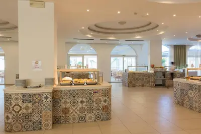 a lobby with a store with aasteryasteryasteryasteryasteryasteryasteryasteryastery at Sun Palace Hotel in Faliraki