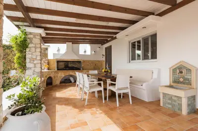 a kitchen and dining room with a table and chairs at Villa Dionysus in Gennadi