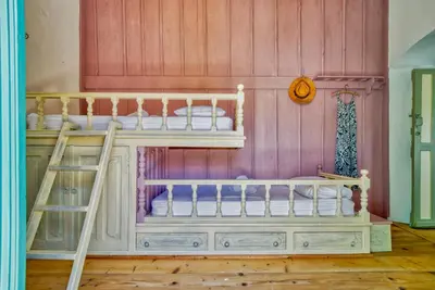 a bunk bed with two bunk beds in a room at Petridi House in Symi