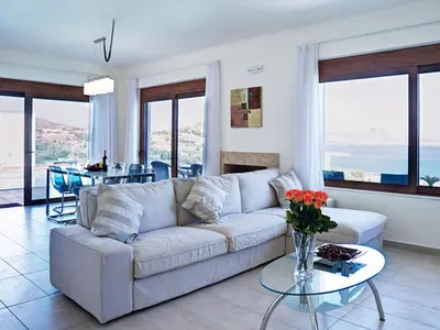 a living room with a couch and a table at Luxury Villa Verna in Líndos