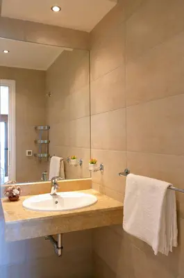 a bathroom with a sink and a mirror at Luxury Villa Verna in Líndos