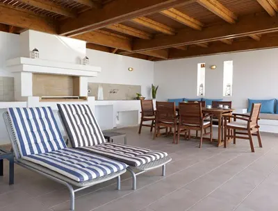 a living room with a dining room table and chairs at Luxury Villa Verna in Líndos