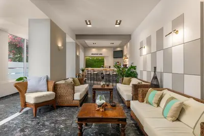 a living room with couches and a table at City Plus Rhodes Hotel in Rhodes Town