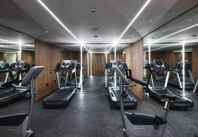 a gym with treadmills and elliptical machines at Leonardo Kolymbia Resort Rhodes in Kolimbia
