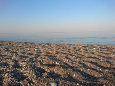 a rocky beach with the ocean in the background at Afantou beach house in Kolimbia