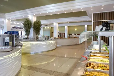 a buffet line with food on display in a restaurant at Sunshine Rhodes in Ialyssos
