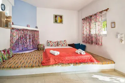a bedroom with a large bed with towels on it at Salora Studio-Apartments in Archangelos
