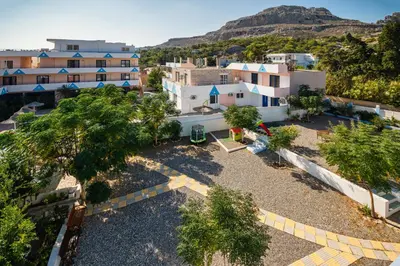 an aerial view of a city with buildings and trees at Salora Studio-Apartments in Archangelos